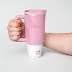 Stockka pink stainless steel thermal mug with handle and lid, double-walled for insulation.