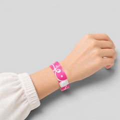 Stockka pink vinyl event wristband with white swirl pattern and secure snap closure. Water and tear resistant.