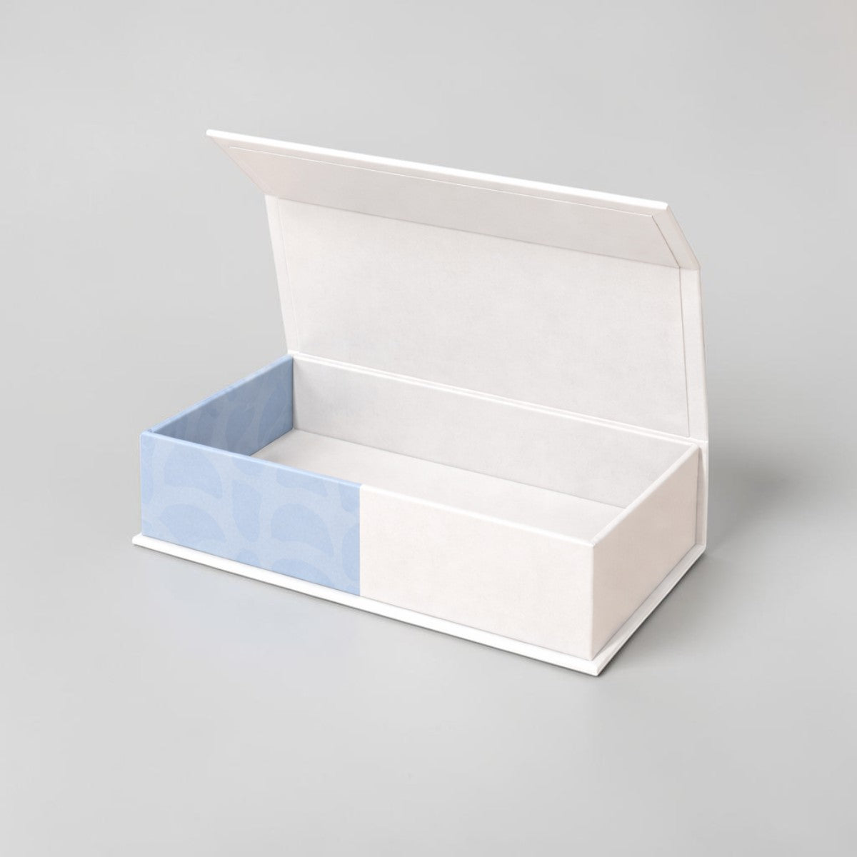 Stockka premium flat box with top opening, white with light blue patterned interior. Rigid cardboard with lamination.