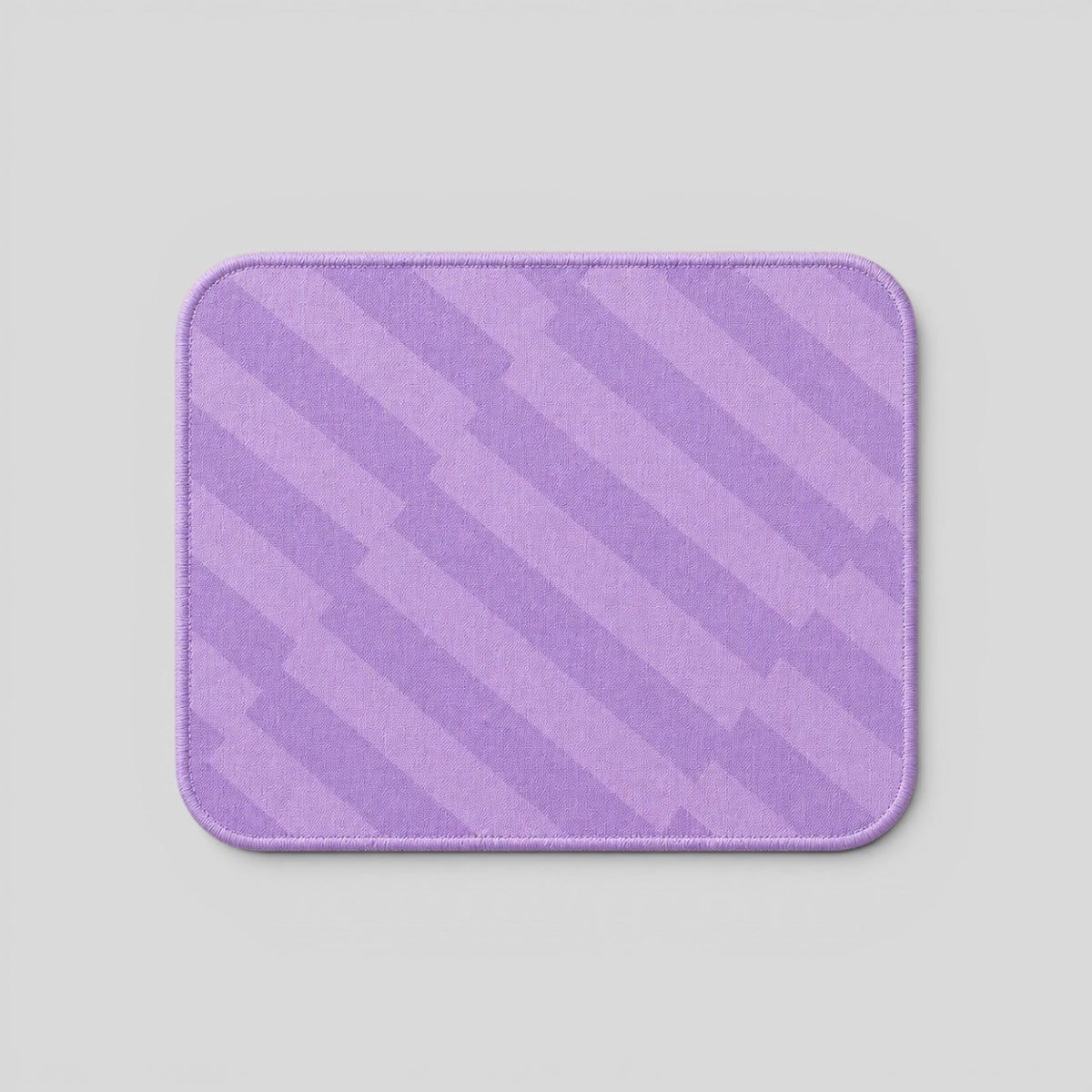 Stockka compact purple mousepad with rounded corners and a striped pattern, ideal for precise movements.