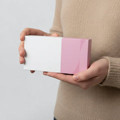 Stockka white and pink rectangular rigid gift box with clean lines and large branding area. Made of laminated cardboard.