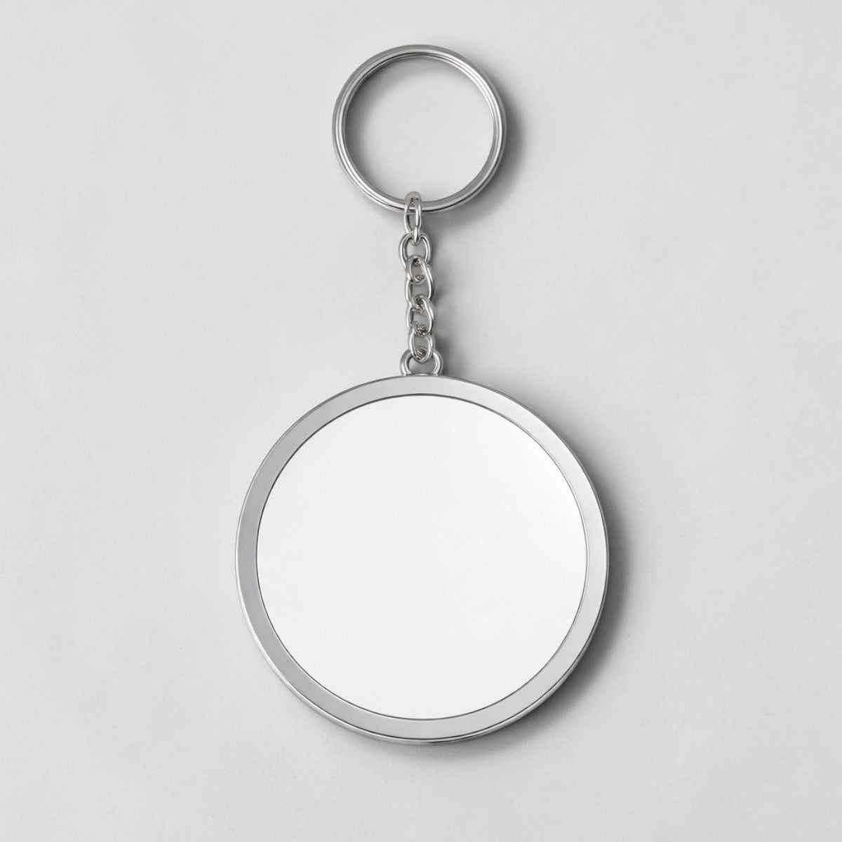 Stockka customisable round acrylic keychain with silver metal frame and chain. Perfect for logos, designs, or photos.