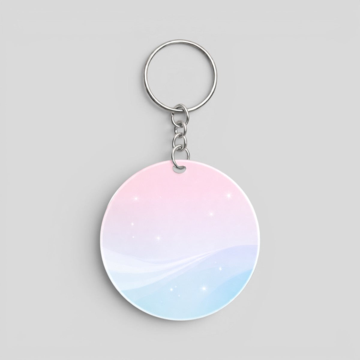Stockka customisable round acrylic keychain with shiny finish and metal chain, pink and blue gradient with subtle sparkle.