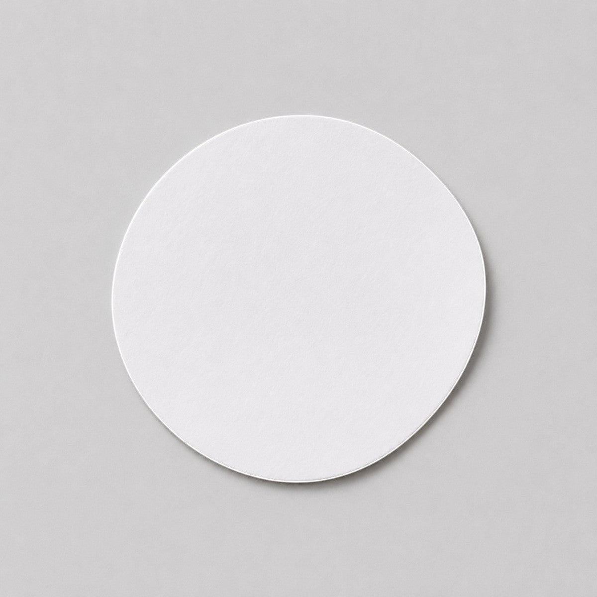 Stockka white round custom cut sticker, ideal for branding products, packaging, and shipping. Matte finish.