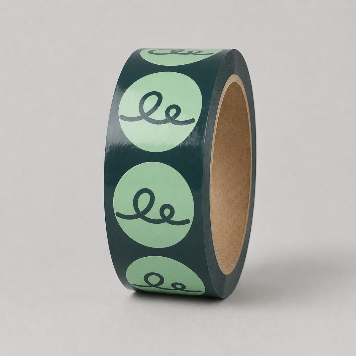 Stockka dark green roll of round stickers with light green circles and a black wavy line design.