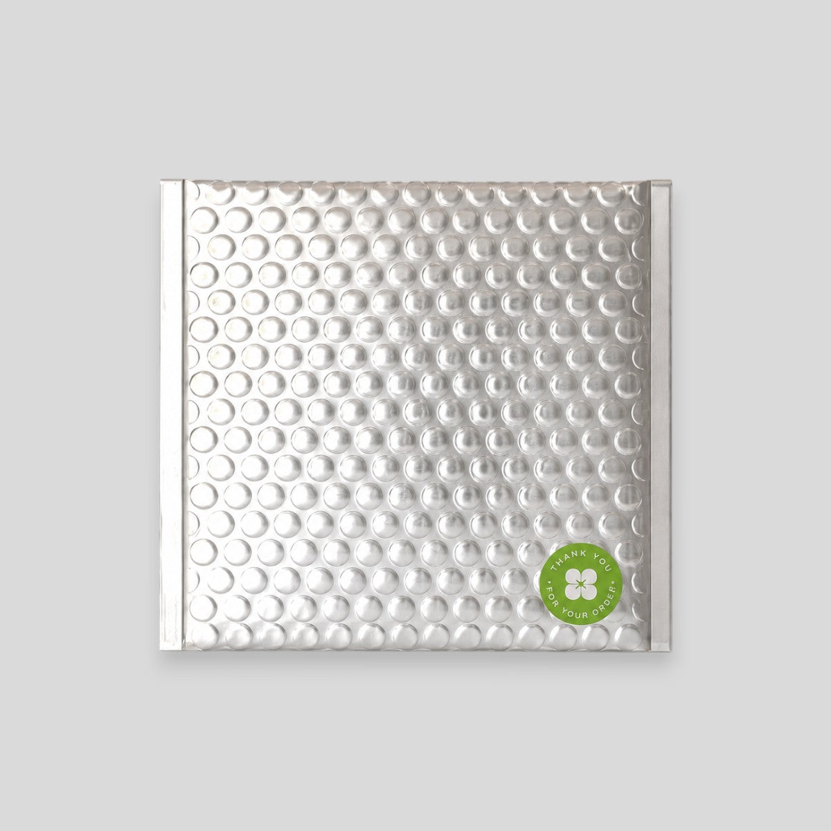 Stockka silver padded bubble mailer, 4.5x7.0 cm, with strong adhesive strip and luxurious look.