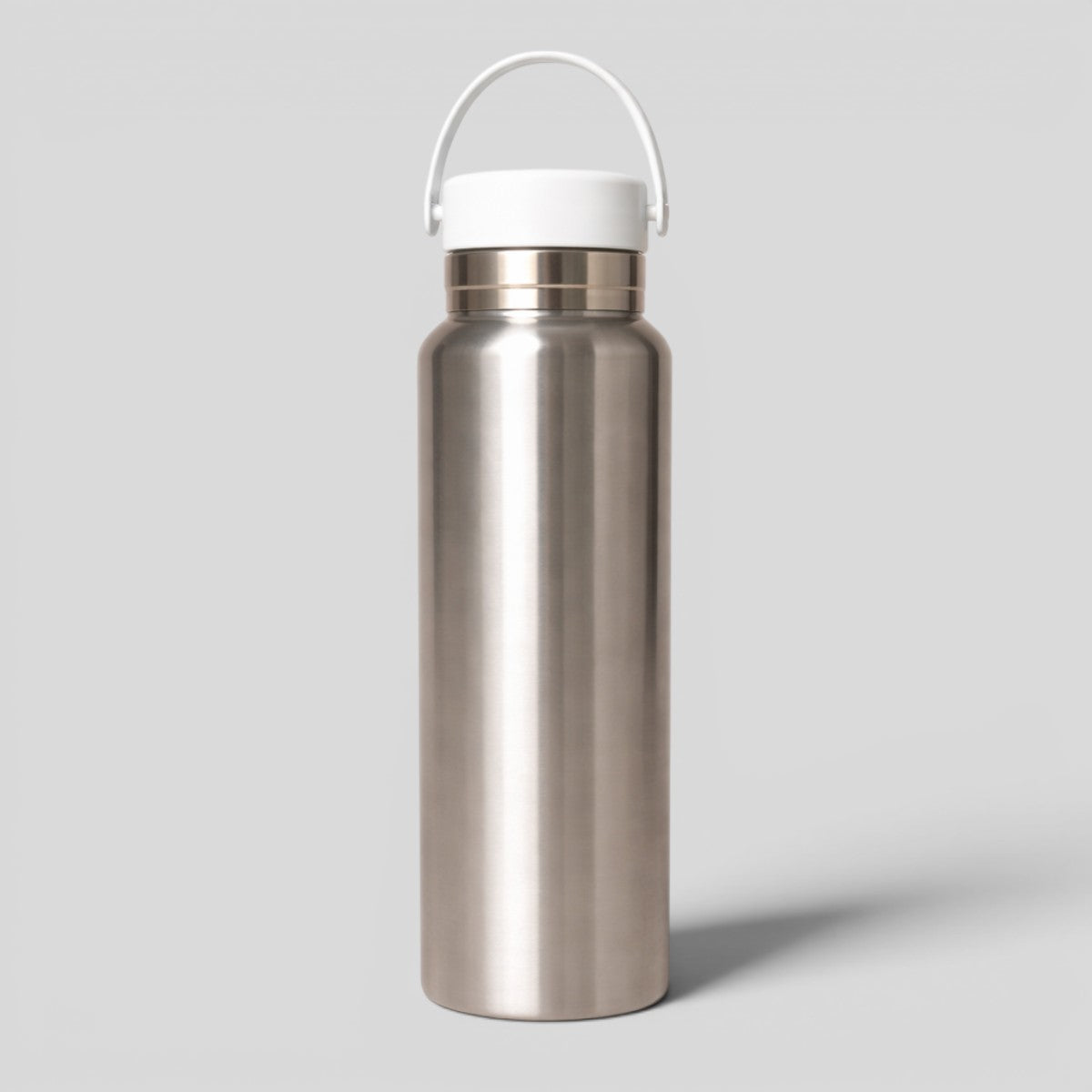 Stockka silver stainless steel water bottle with white silicone handle and lid, ideal for daily use, travel, office, or sports.