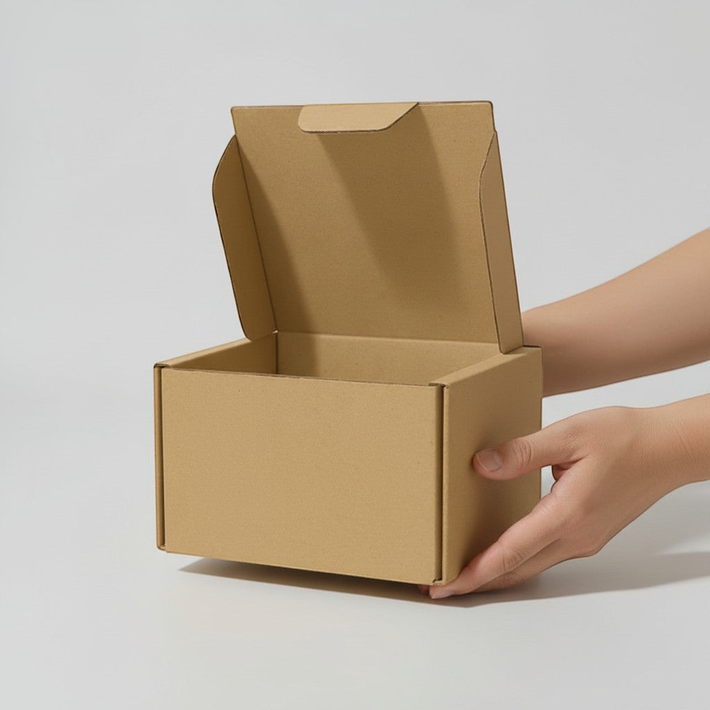 Stockka small corrugated cardboard mailer box with front closure, perfect for shipping small items.