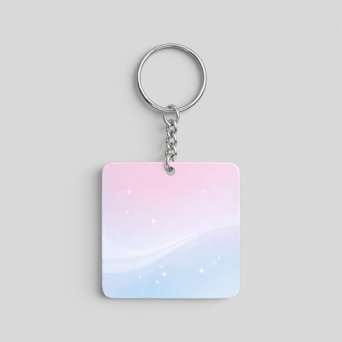 Stockka square acrylic keychain with a pastel pink and blue gradient, featuring subtle sparkles and a silver metal chain.