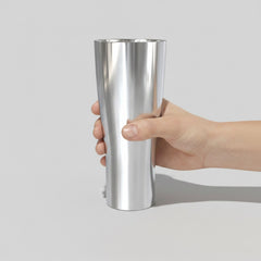 Stockka tall stainless steel tumbler with a curved body, ideal for hot or cold drinks.