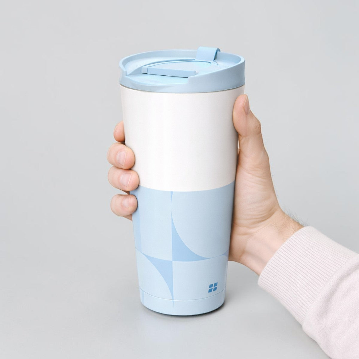Stockka tall white and light blue stainless steel travel mug with lid, double-walled for insulation.