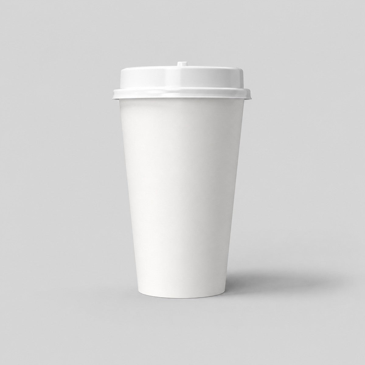 Stockka tall white paper cup with a brown kraft sleeve and a white plastic lid, ideal for hot beverages.