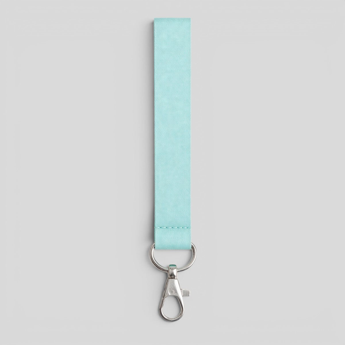 Stockka teal polyester lanyard with silver metal clip and keyring, perfect for keys or USB drives.