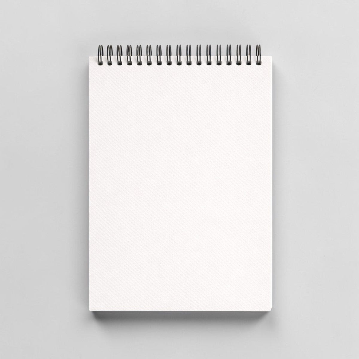 Stockka top spiral notebook with 80 lined pages and soft cover. Customizable green design.