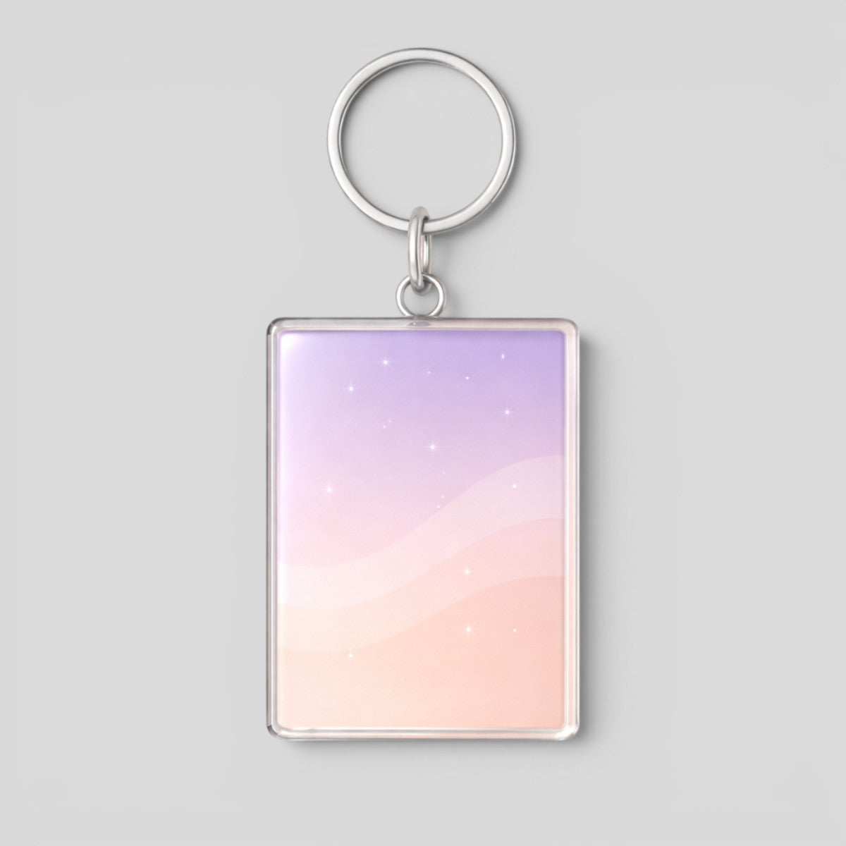Stockka vertical rectangular acrylic keychain with smooth finish and metal ring, featuring a pastel gradient of purple and peach with subtle sparkles.