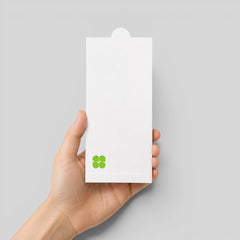 Stockka white matte vertical envelope with a round tab closure, held in a hand for gift cards or documents.