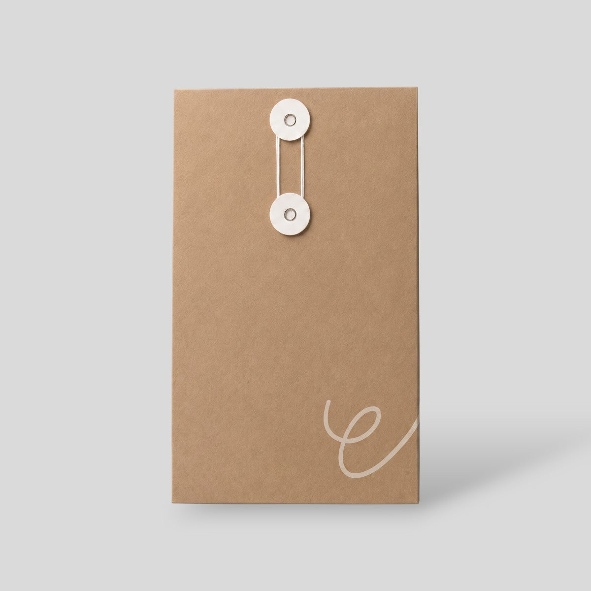 Stockka vertical brown kraft paper envelope with white string and disc closure for documents and marketing materials.