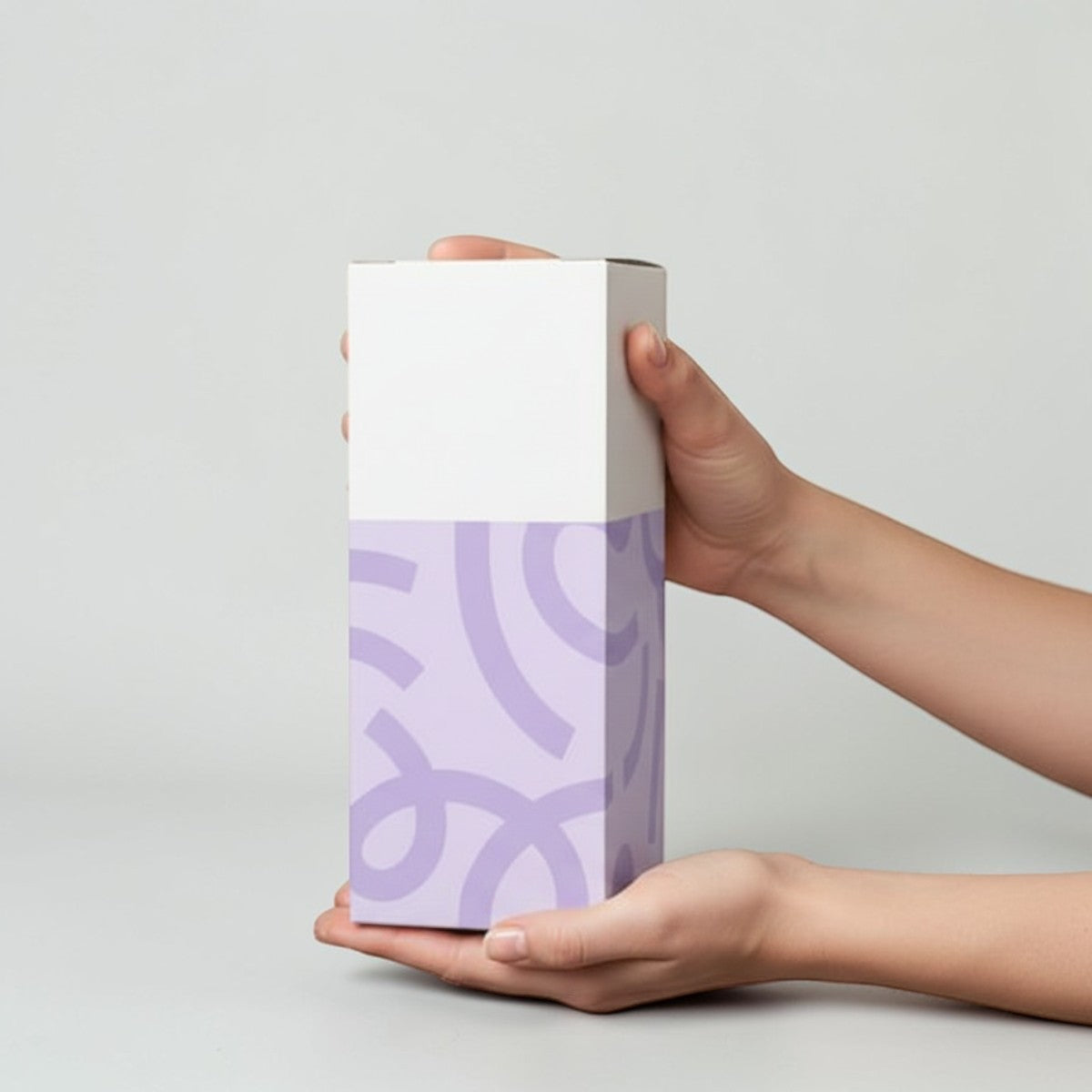 Stockka vertical wine box with top opening, made of coated cardboard, white top and lavender pattern bottom.