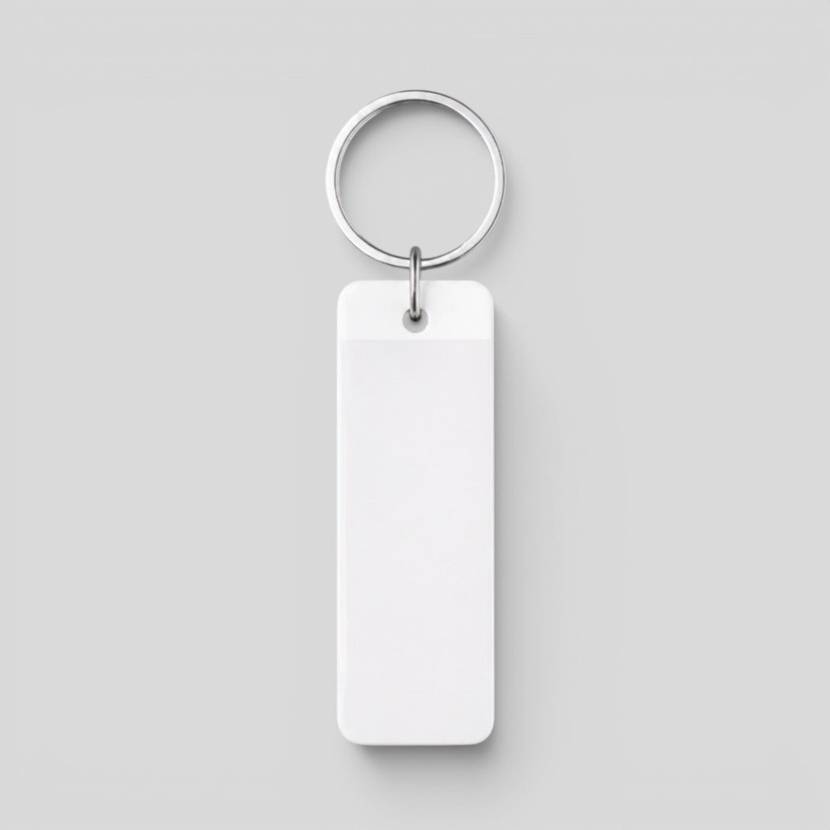 Stockka white rectangular acrylic keychain with metal ring, perfect for custom logos and branding.