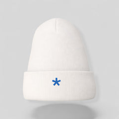 Stockka white acrylic knit beanie with a folded brim and a small blue asterisk logo.