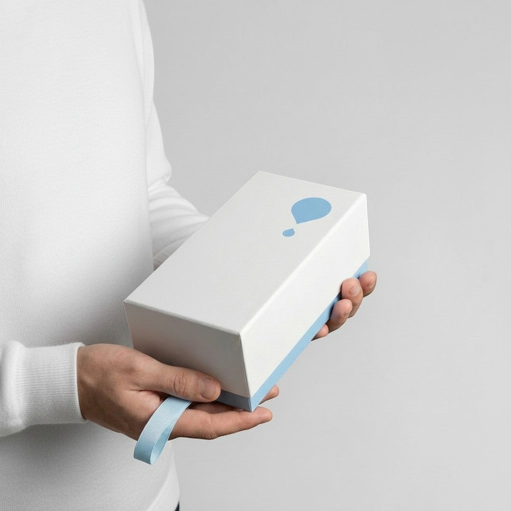 Stockka white rectangular gift box with blue trim and logo, featuring a drawer-style opening with a pull ribbon.