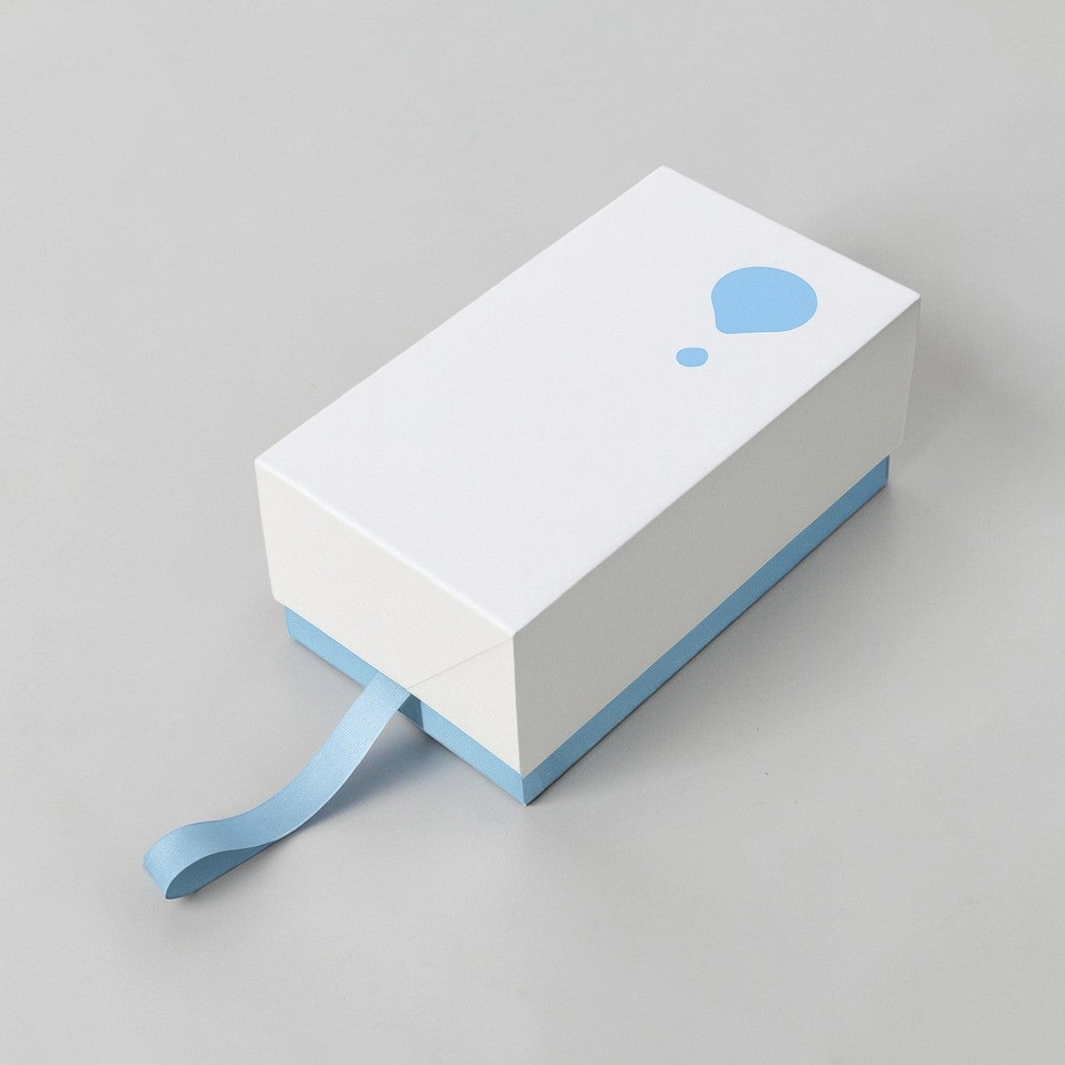 Stockka white rectangular gift box with blue trim and pull tab, featuring a light blue droplet logo.