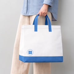 Stockka large white and blue laminated non-woven tote bag with strong handles, perfect for retail or events.
