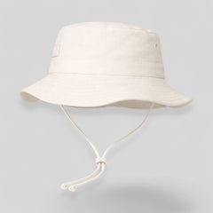 Stockka white cotton-polyester blend bucket hat with chin strap, ideal for surfing, beach, golf, and fishing.
