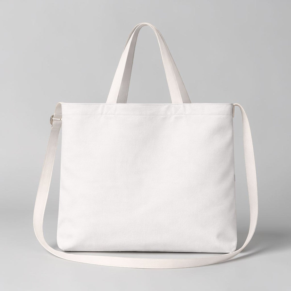 Stockka white canvas messenger bag with dual straps, perfect for everyday use or custom branding.