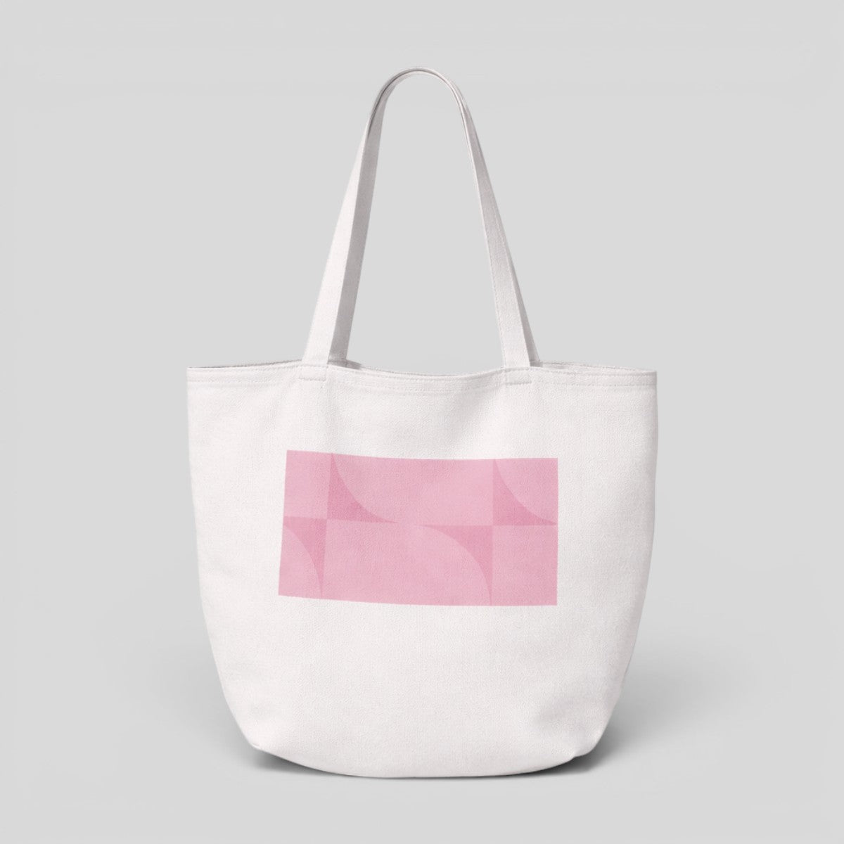 Stockka white canvas tote bag with pink geometric pattern and long shoulder straps.