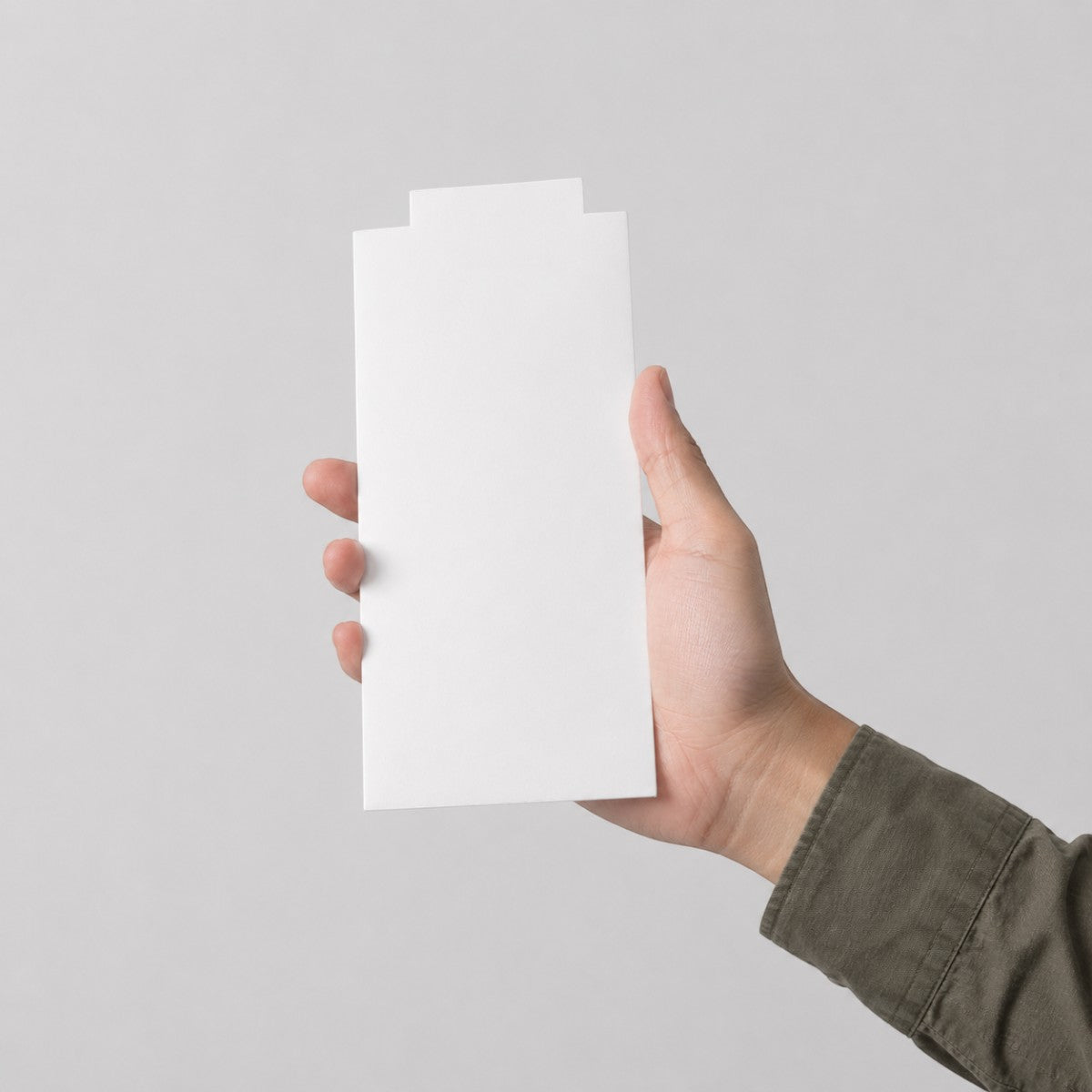Stockka minimalist white matte coated cardboard envelope for narrow documents, gift cards, or printed material.