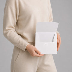 Stockka white matte coated cardboard envelope with front opening and internal tabs for secure closure.