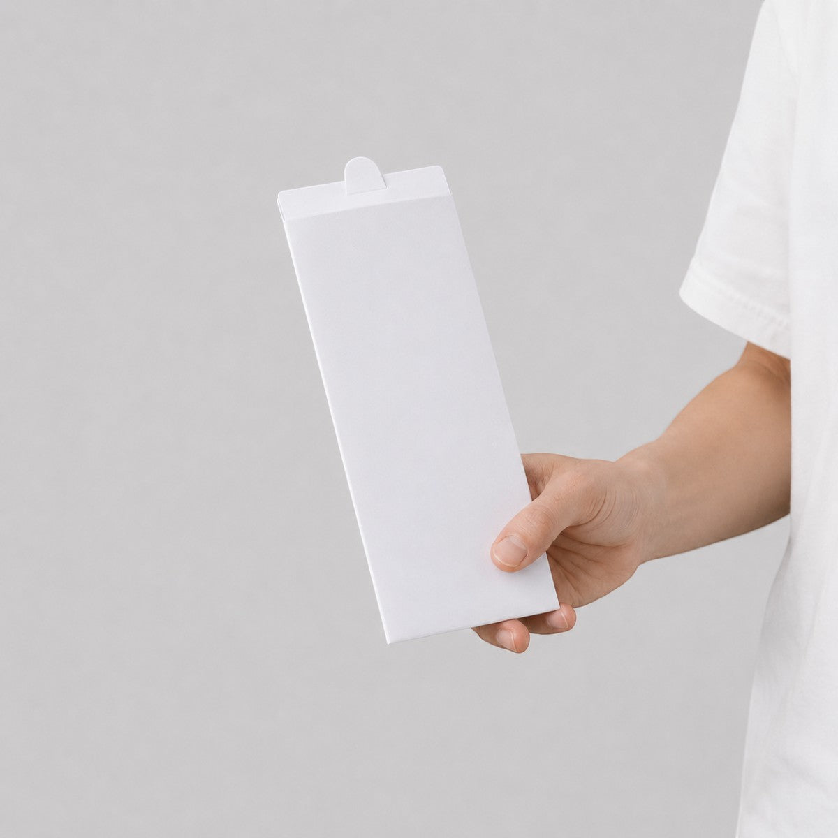 Stockka white cardboard envelope with top tab closure, perfect for small products, stationery, or branded kits.
