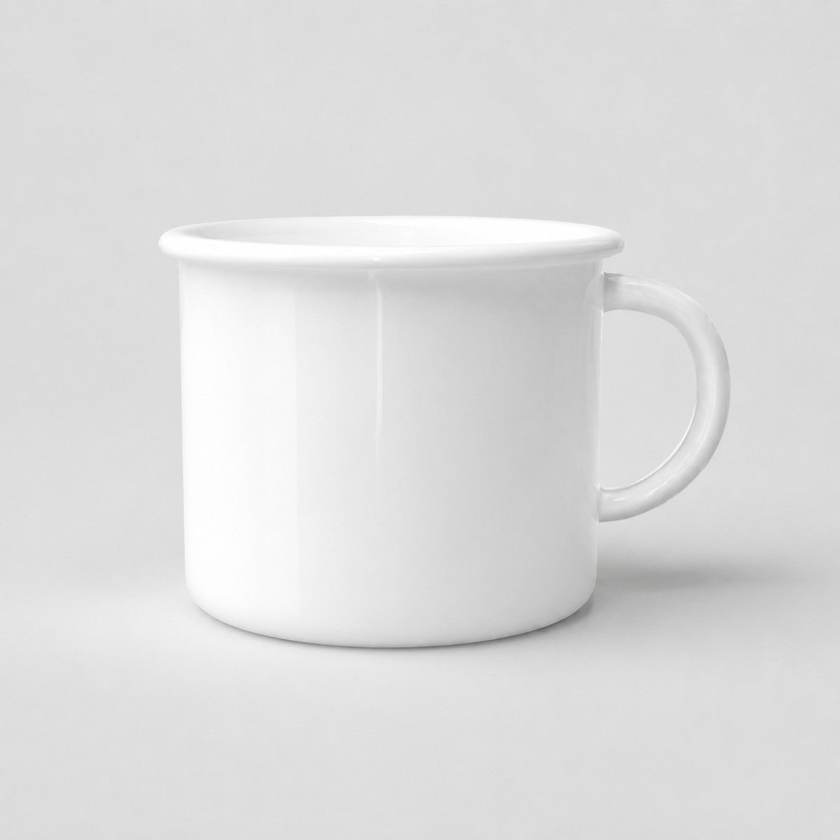 Stockka white ceramic camping-style mug with a wide rim and compact handle on a neutral background