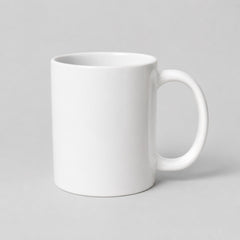 Stockka classic white ceramic mug with a comfortable handle for coffee or tea, isolated on a light grey background.