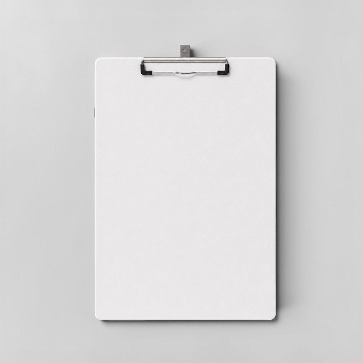 Stockka white corrugated cardboard clipboard with a silver metal clip, perfect for events and conferences.