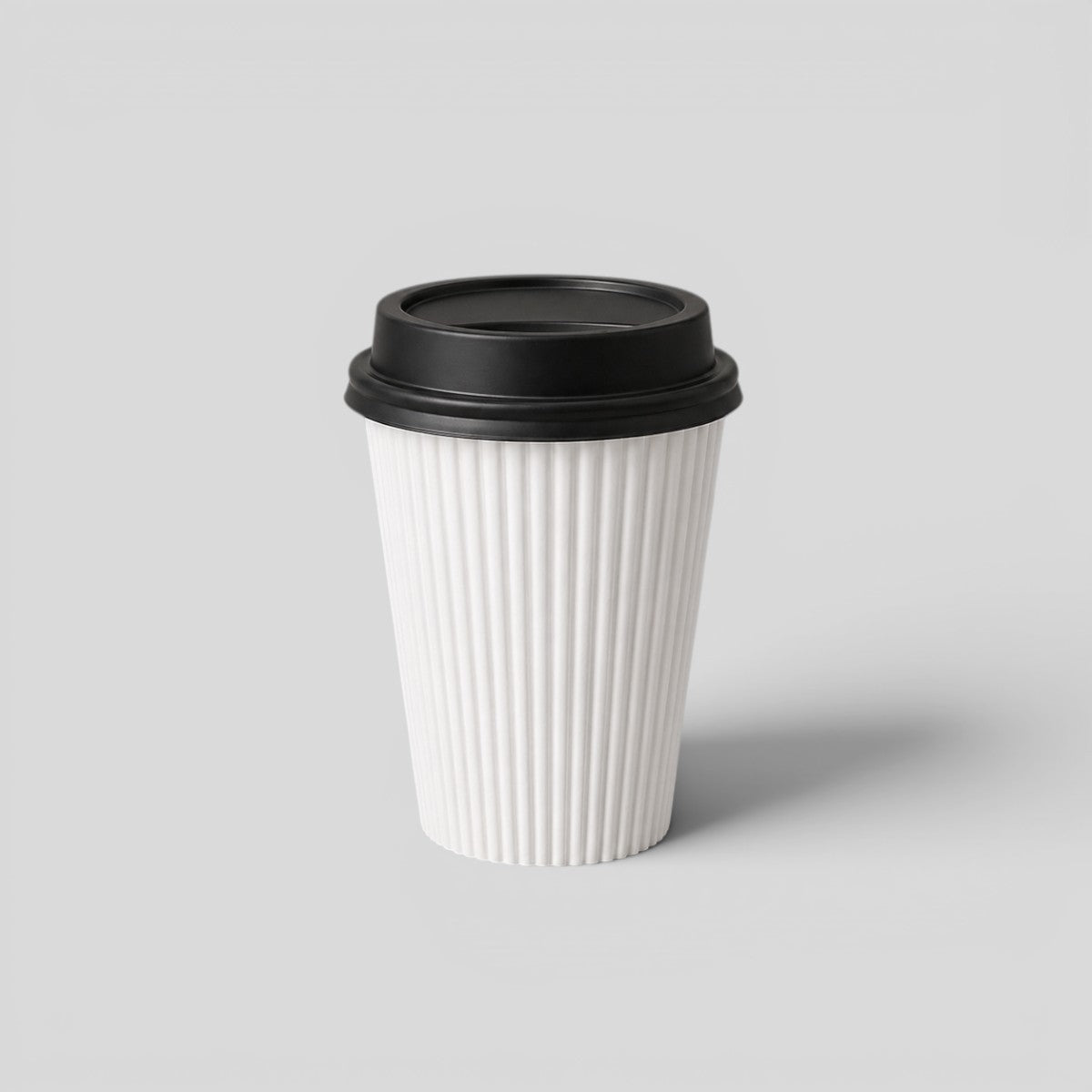 Stockka white paper coffee cup with black lid and corrugated texture for hot beverages.