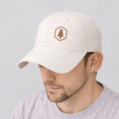 Stockka white cotton twill baseball cap with adjustable plastic closure and embroidered tree logo.