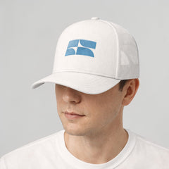Stockka white cotton mesh trucker hat with blue logo detail. Adjustable, one size fits all.