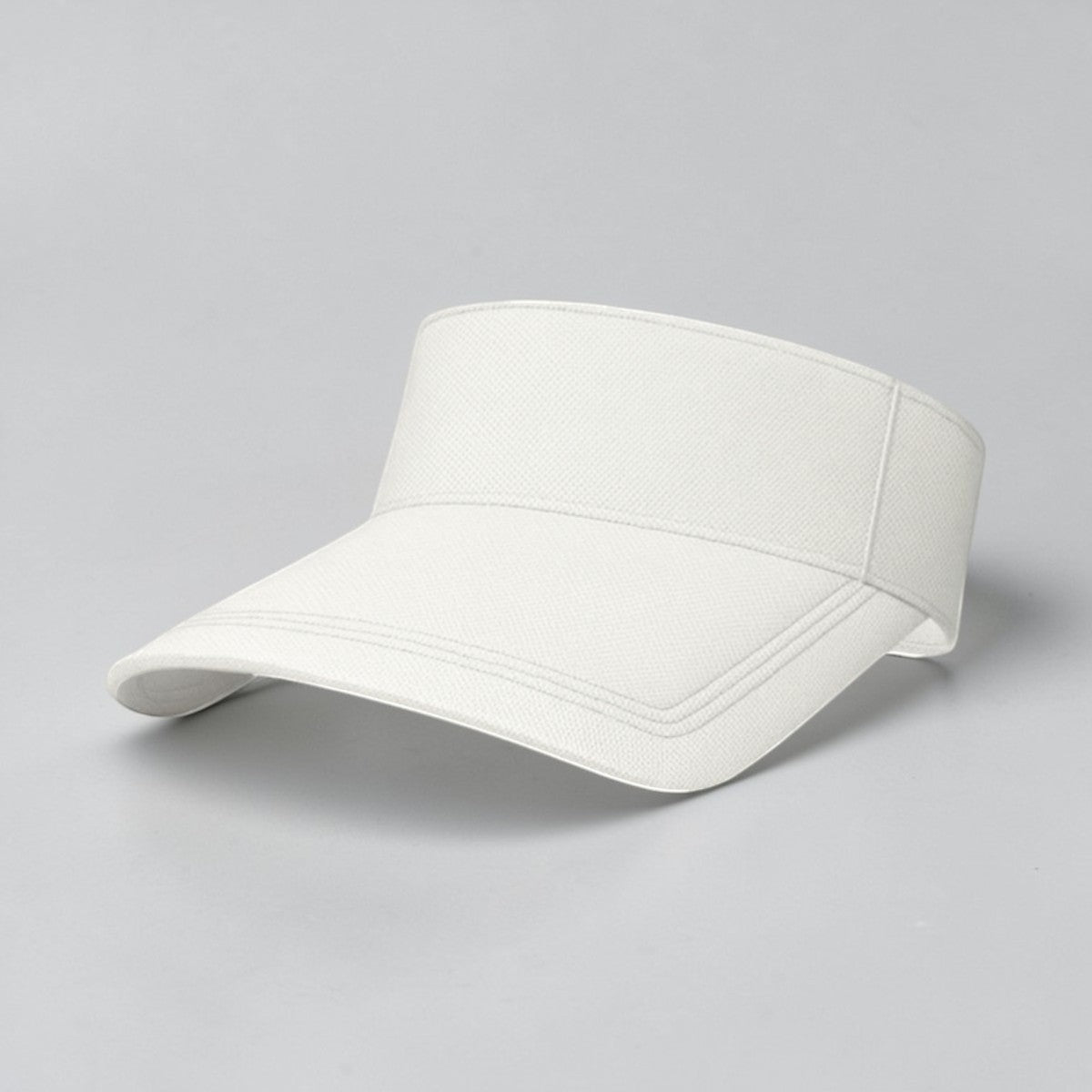 Stockka white cotton tennis visor with adjustable strap and curved brim for sun protection.