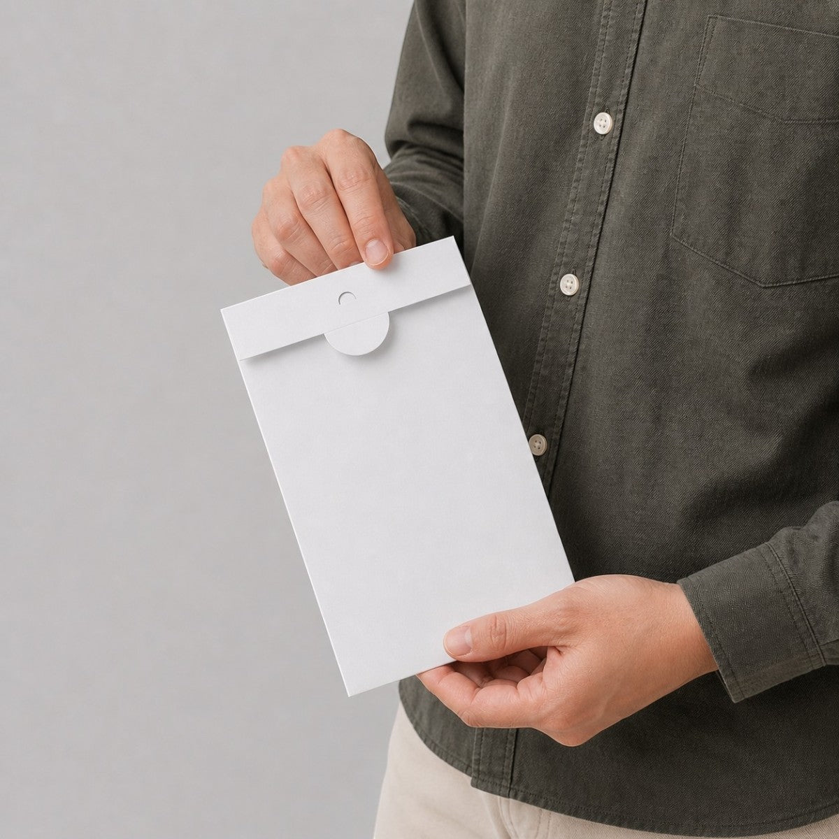 Stockka white matte coated cardboard envelope with round tuck-lock closure for greeting cards and invitations.