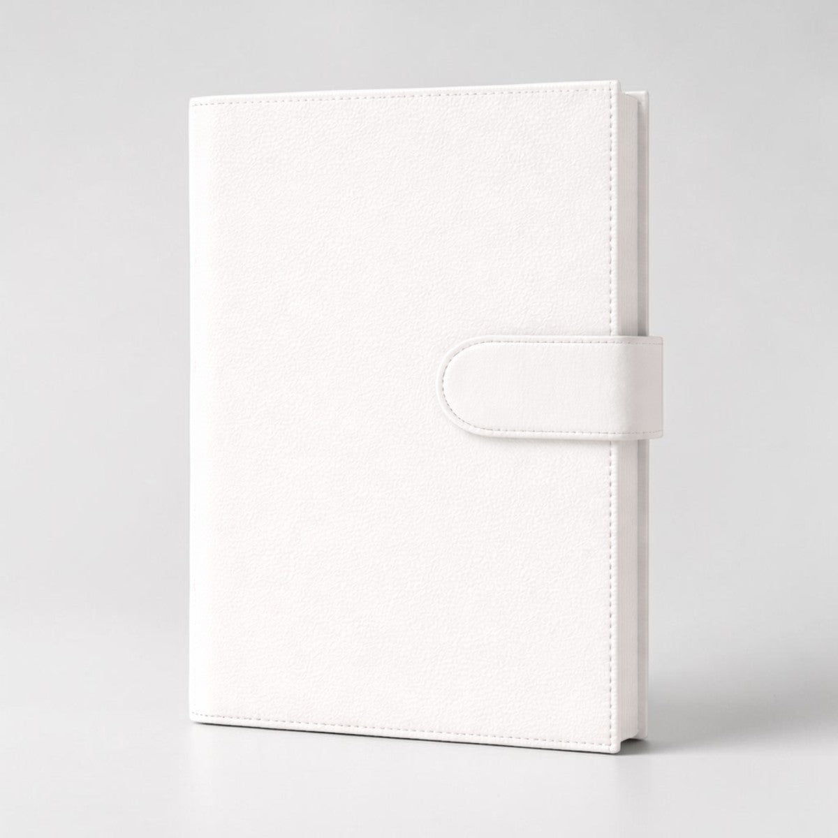 Stockka white faux leather notebook with magnetic closure, 80 lined pages, and customizable cover.