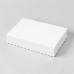 Stockka minimalist white flat cardboard gift box for shirts and apparel. High-quality rigid cardstock packaging.