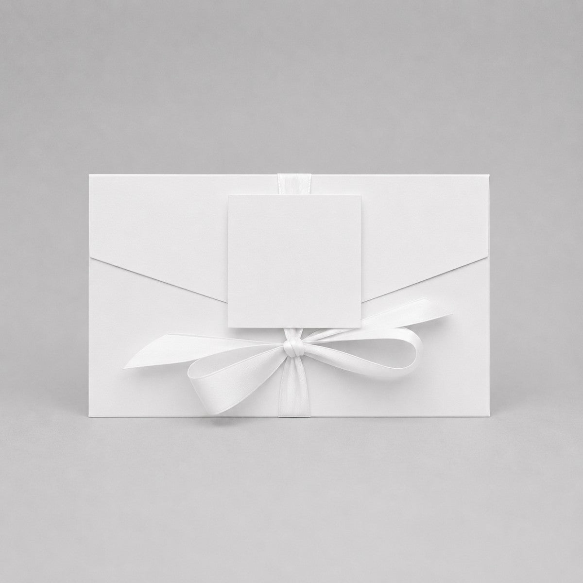 Stockka premium white paper gift envelope with satin ribbon and tag, perfect for luxury orders or gift cards.