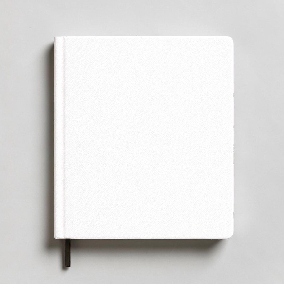 Stockka white hardback notebook with 80 lined pages and a black ribbon bookmark, perfect for custom designs.