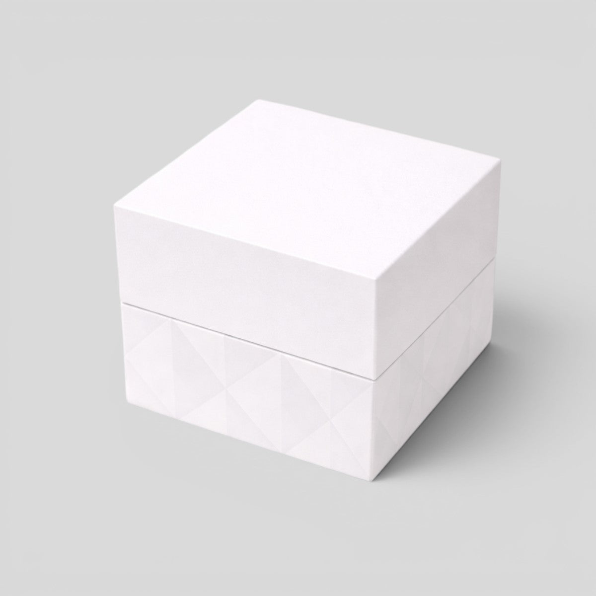 Stockka white cubic jewelry box with removable lid, matte finish, geometric pattern on base.