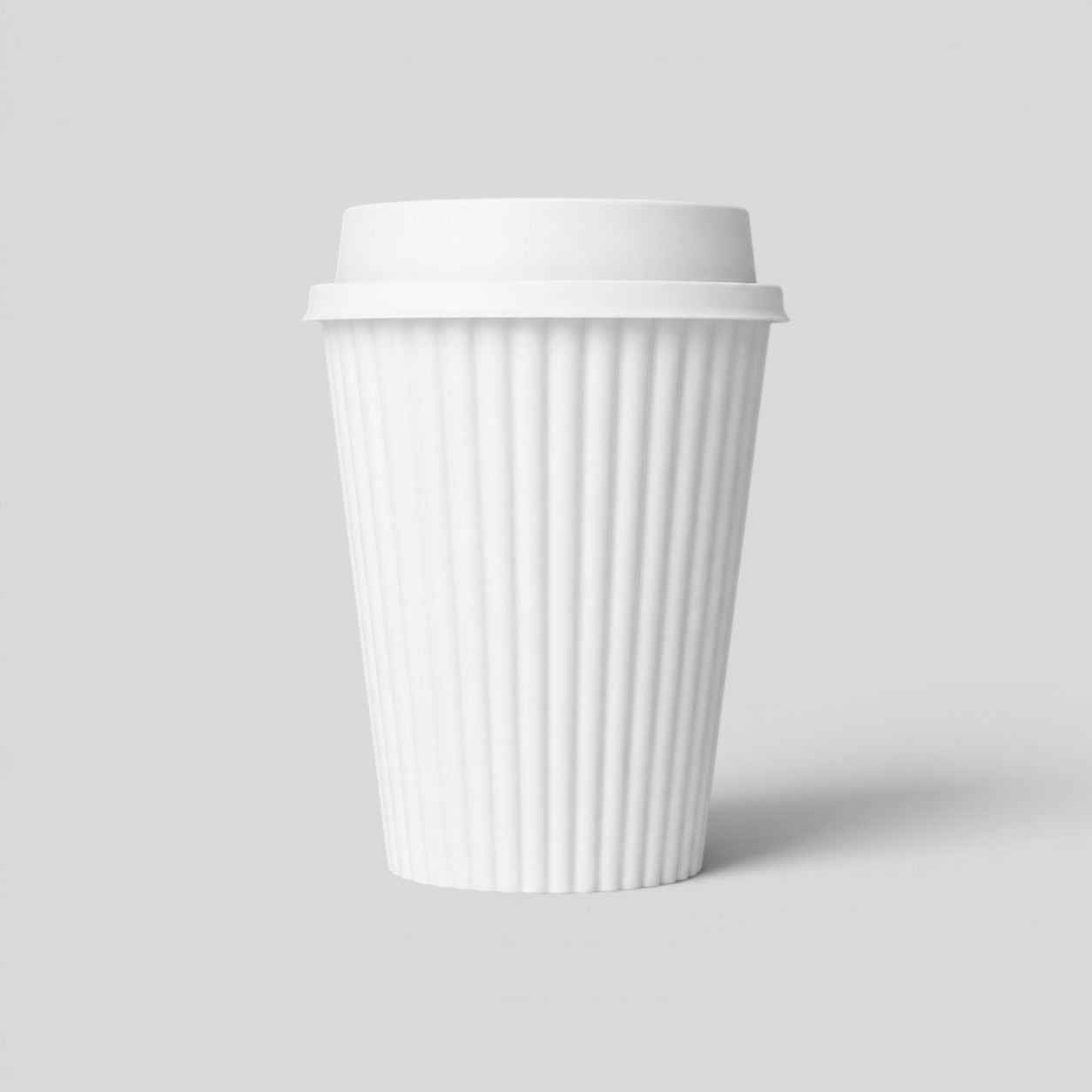 Stockka white ribbed kraft paper coffee cup with a white plastic lid, 380ml capacity, ideal for hot beverages on the go.