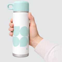 Stockka white stainless steel thermal bottle with mint green abstract pattern and carrying loop lid.