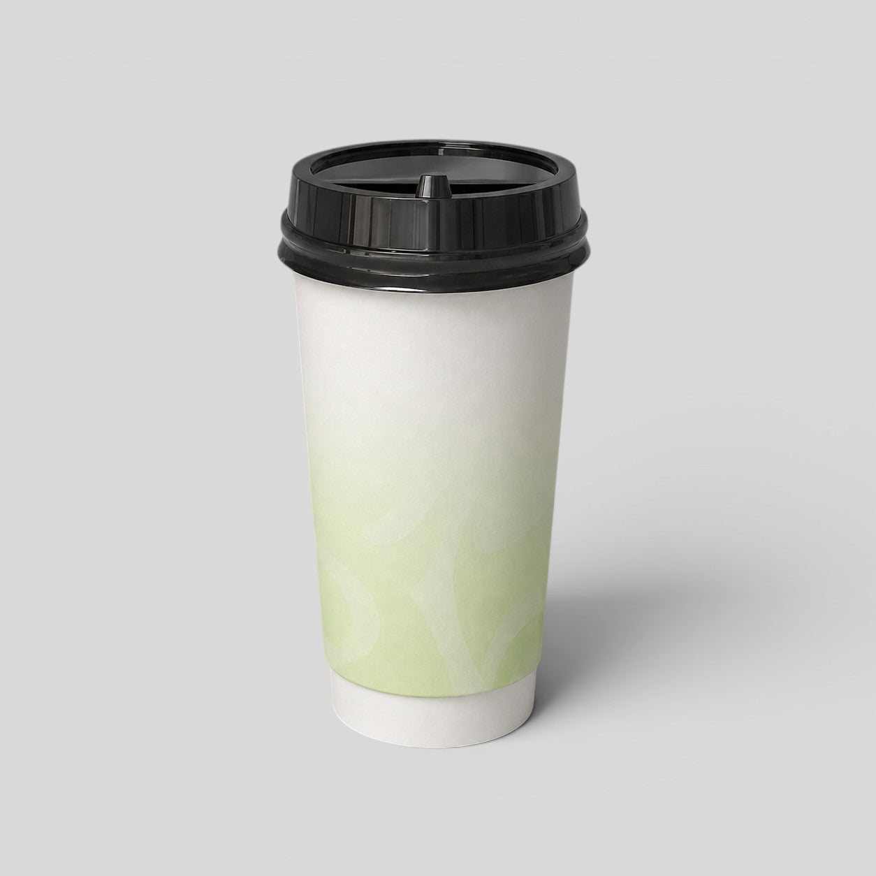 Stockka white paper coffee cup with a black lid, featuring a subtle green swirl pattern. Ideal for hot beverages.