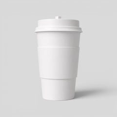 Stockka 473ml double-walled white paper coffee cup with insulating sleeve and black lid.